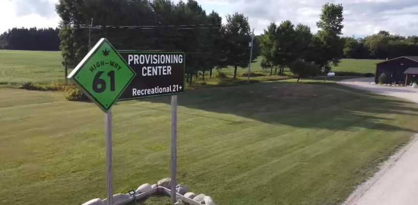 The 61 Provisioning Center shield sign on the Standish building