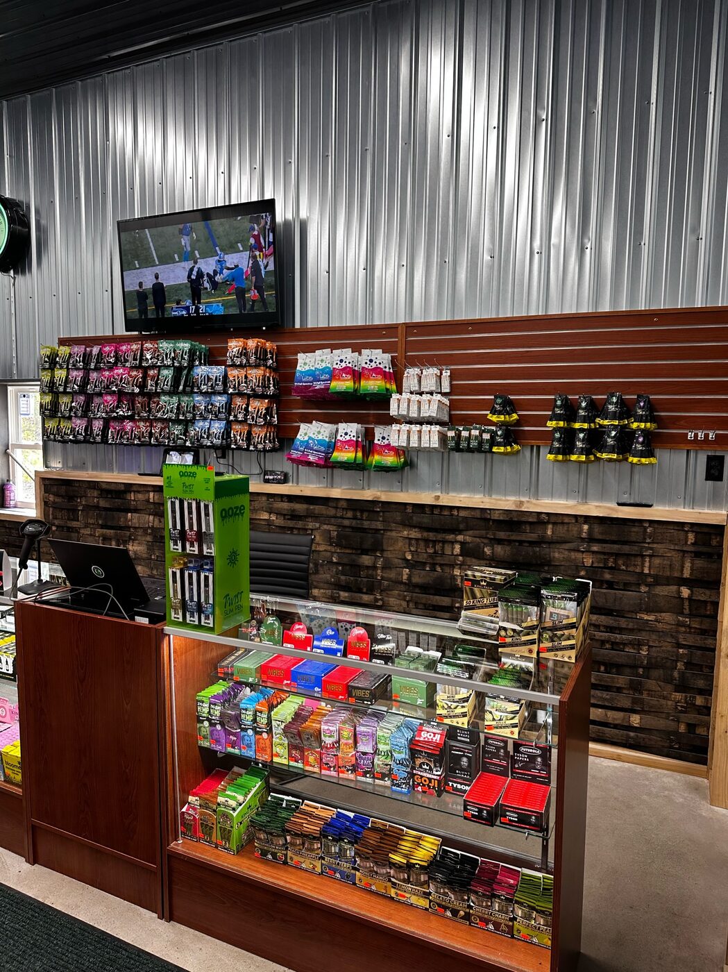 Shelves of edibles and packaged cannabis products inside the Highway Dispos store.