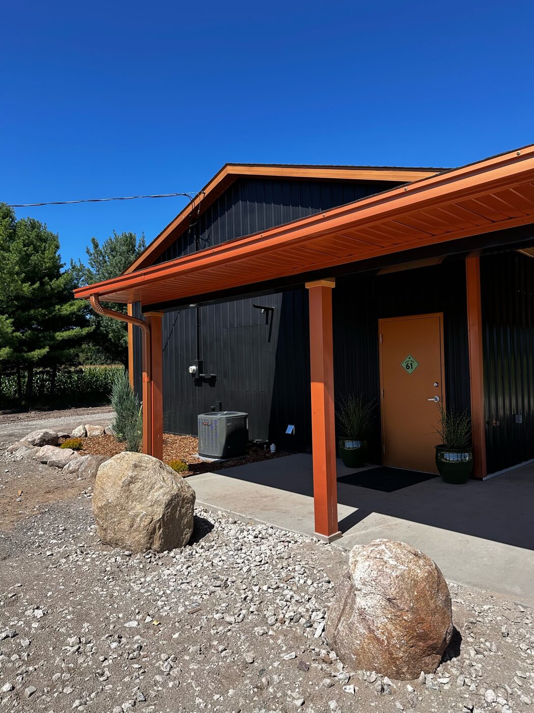 The Highway Dispos store in Standish on M-61, a black building with orange accents.
